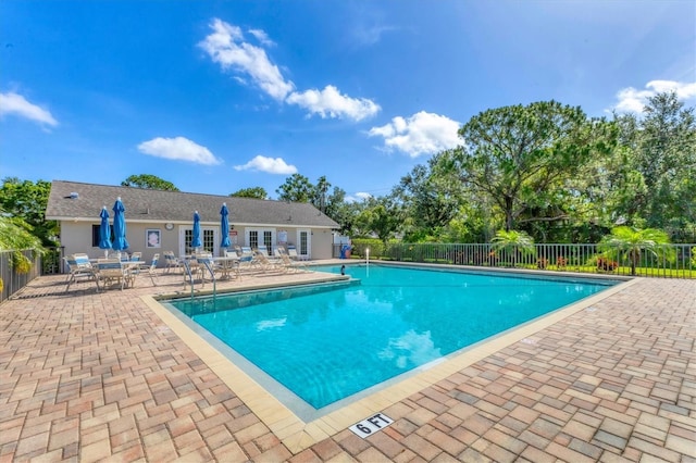 7866 Eagle Creek Dr Unit 7866, Sarasota, FL 34243 - community pool with a patio area and view of wooded area