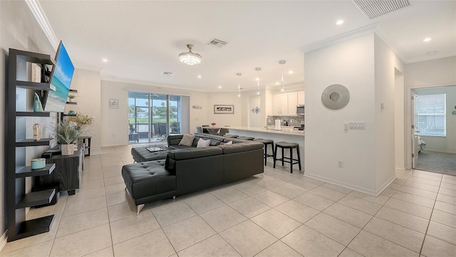 5910 Hevena Ct, Palmetto, FL 34221 - living area featuring crown molding, light tile patterned floors, and recessed lighting