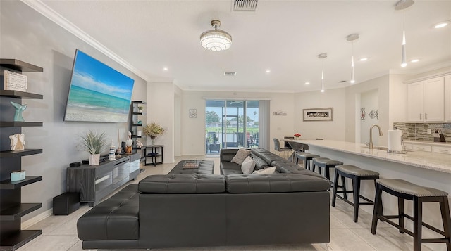 5910 Hevena Ct, Palmetto, FL 34221 - living area featuring light tile patterned floors, crown molding, and recessed lighting