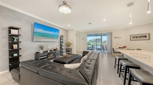5910 Hevena Ct, Palmetto, FL 34221 - living area with light tile patterned floors, crown molding, and recessed lighting