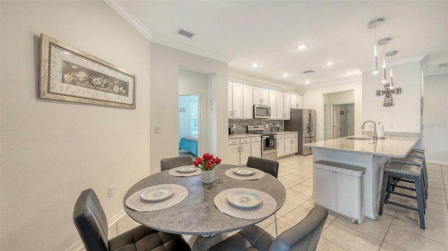 5910 Hevena Ct, Palmetto, FL 34221 - dining space featuring ornamental molding, light tile patterned floors, and recessed lighting