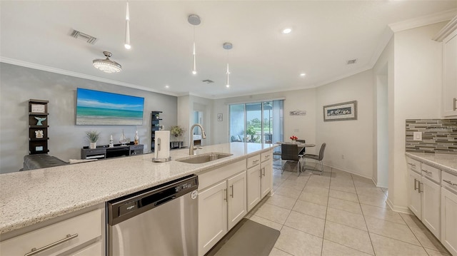 5910 Hevena Ct, Palmetto, FL 34221 - kitchen featuring stainless steel dishwasher, ornamental molding, decorative backsplash, light stone counters, and white cabinetry