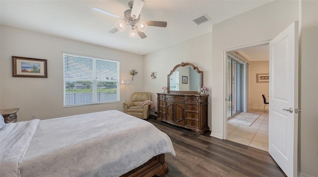 5910 Hevena Ct, Palmetto, FL 34221 - bedroom with dark wood finished floors and a ceiling fan