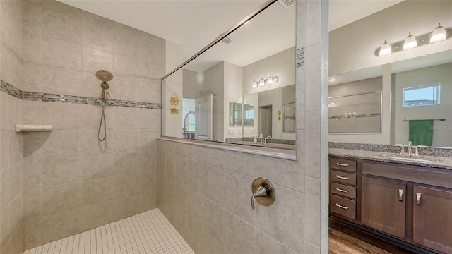 5910 Hevena Ct, Palmetto, FL 34221 - bathroom featuring walk in shower, vanity, and wood finished floors