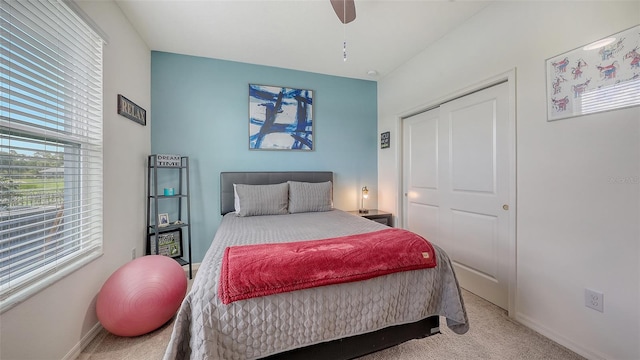 5910 Hevena Ct, Palmetto, FL 34221 - bedroom with multiple windows, carpet floors, and ceiling fan
