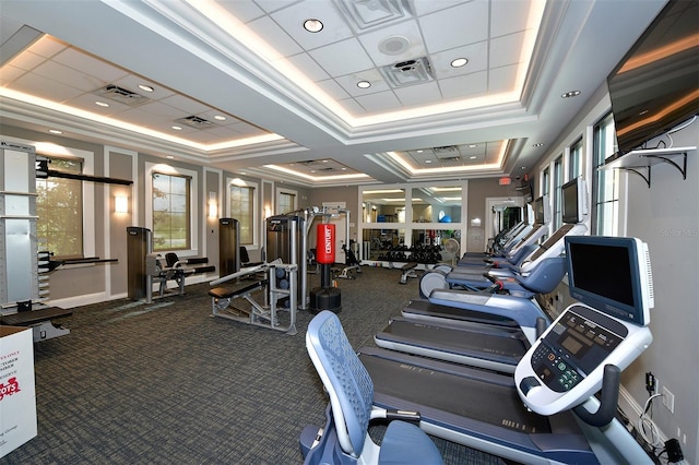 5910 Hevena Ct, Palmetto, FL 34221 - exercise room featuring a tray ceiling and crown molding
