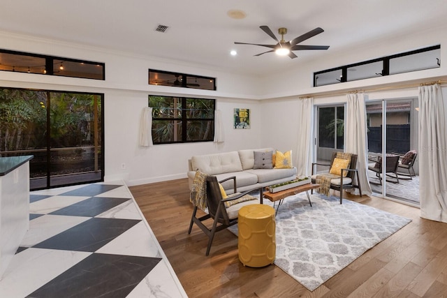 9122 16th Avenue Cir NW, Bradenton, FL 34209 - living room featuring a ceiling fan, wood finished floors, and recessed lighting
