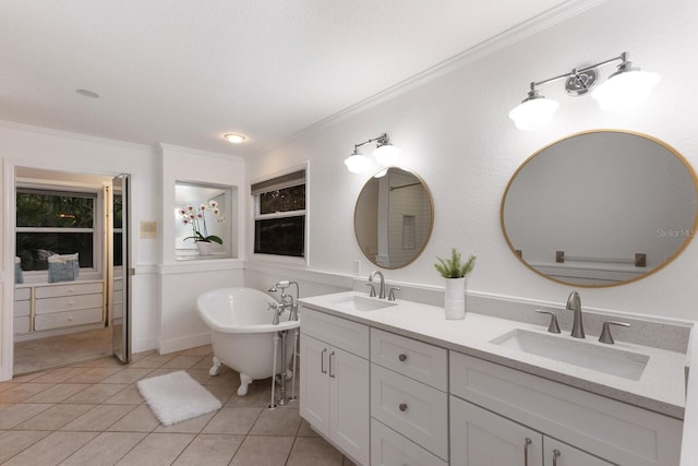 9122 16th Avenue Cir NW, Bradenton, FL 34209 - full bath with double vanity, a freestanding bath, tile patterned floors, and crown molding