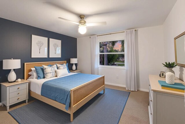 9122 16th Avenue Cir NW, Bradenton, FL 34209 - bedroom with light colored carpet and a ceiling fan