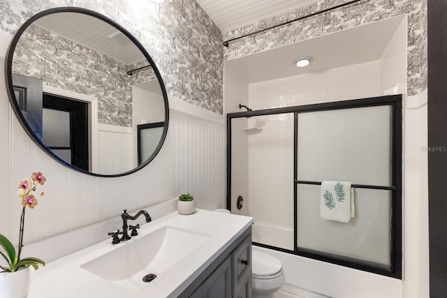 9122 16th Avenue Cir NW, Bradenton, FL 34209 - bathroom featuring vanity, combined bath / shower with glass door, and a wainscoted wall