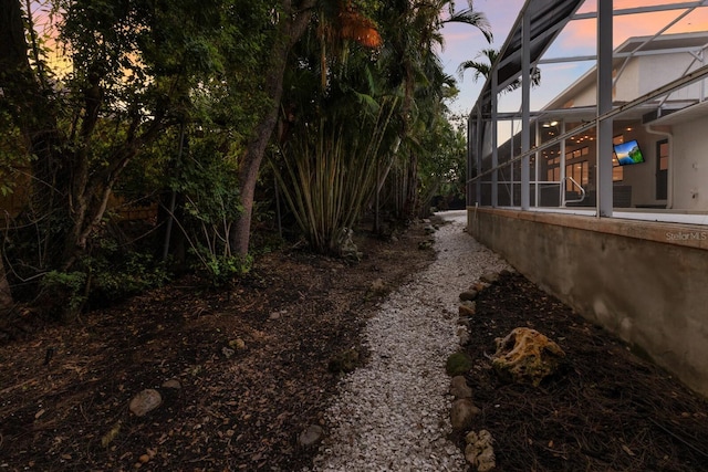9122 16th Avenue Cir NW, Bradenton, FL 34209 - yard at dusk with glass enclosure