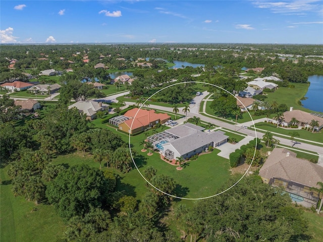 8924 Misty Creek Dr, Sarasota, FL 34241 - aerial perspective of suburban area featuring a large body of water and a tree filled landscape