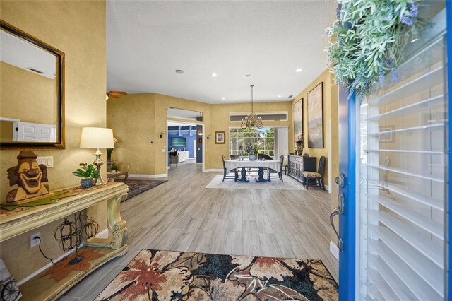 8924 Misty Creek Dr, Sarasota, FL 34241 - foyer with wood finished floors and recessed lighting