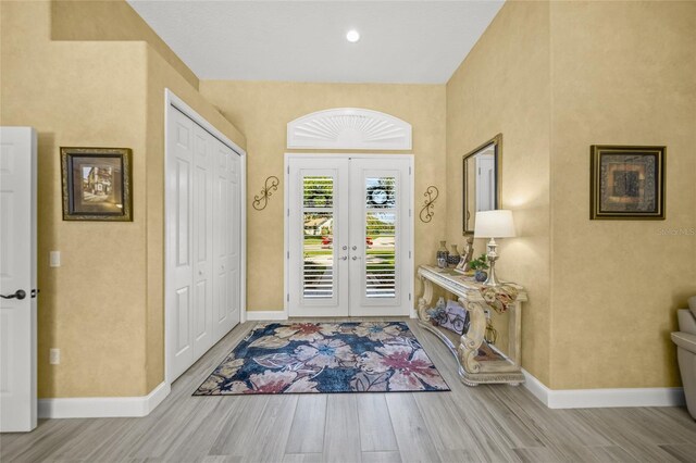 8924 Misty Creek Dr, Sarasota, FL 34241 - entryway with wood finished floors and french doors