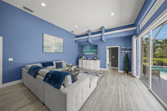 8924 Misty Creek Dr, Sarasota, FL 34241 - living area featuring light wood-type flooring, recessed lighting, and beamed ceiling