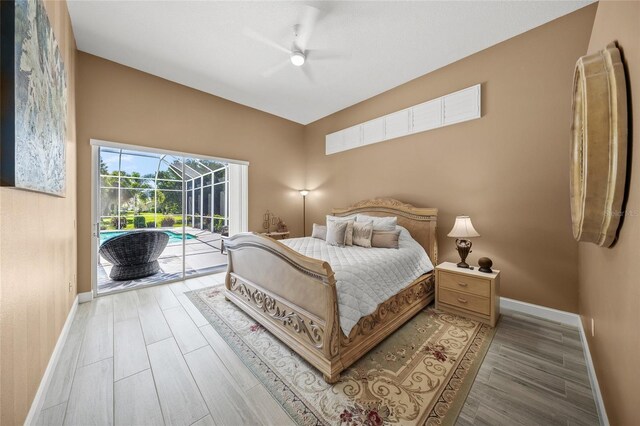 8924 Misty Creek Dr, Sarasota, FL 34241 - bedroom with a sunroom, access to outside, light wood finished floors, and a ceiling fan