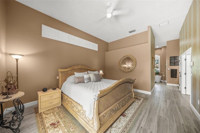 8924 Misty Creek Dr, Sarasota, FL 34241 - bedroom with light wood-style flooring and a ceiling fan