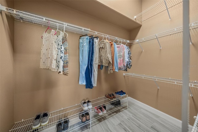 8924 Misty Creek Dr, Sarasota, FL 34241 - walk in closet with wood finished floors