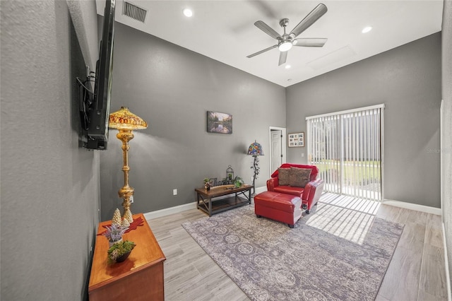 8924 Misty Creek Dr, Sarasota, FL 34241 - sitting room with a towering ceiling, ceiling fan, wood finished floors, and recessed lighting