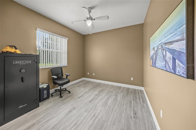 8924 Misty Creek Dr, Sarasota, FL 34241 - office area with a ceiling fan, light wood-type flooring, and a textured ceiling