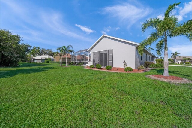 8924 Misty Creek Dr, Sarasota, FL 34241 - view of grassy yard with a lanai