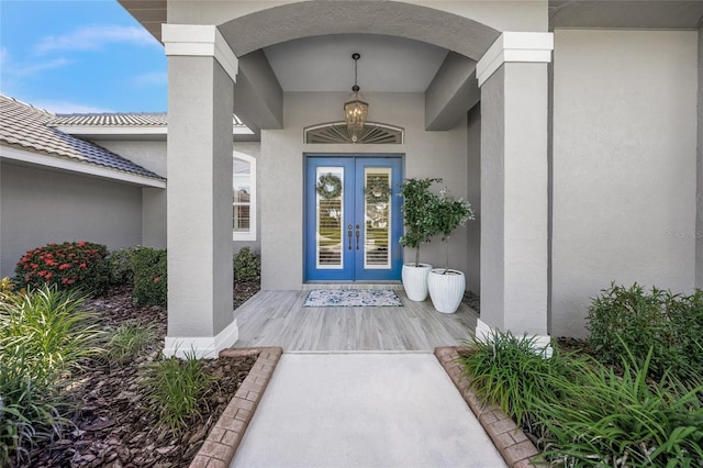 8924 Misty Creek Dr, Sarasota, FL 34241 - doorway to property with french doors and stucco siding