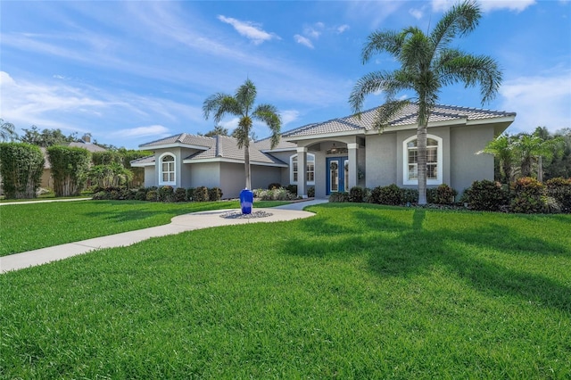 8924 Misty Creek Dr, Sarasota, FL 34241 - view of front of home with a front lawn and stucco siding
