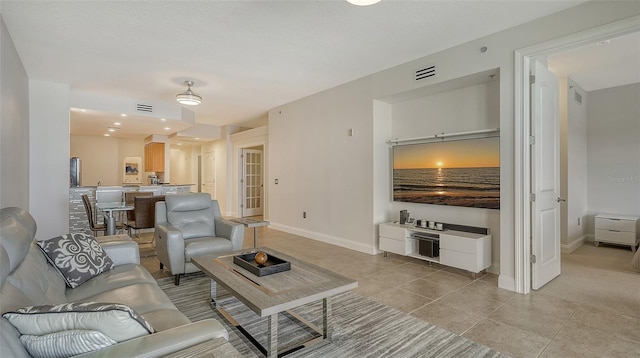 610 Riviera Dunes Way Unit 306, Palmetto, FL 34221 - living room with baseboards and light tile patterned floors