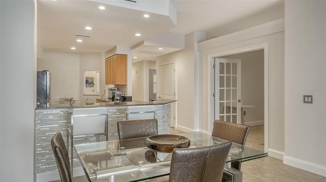 610 Riviera Dunes Way Unit 306, Palmetto, FL 34221 - dining room with light tile patterned flooring and recessed lighting