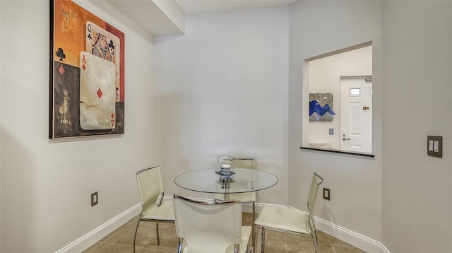610 Riviera Dunes Way Unit 306, Palmetto, FL 34221 - dining room featuring tile patterned flooring and baseboards