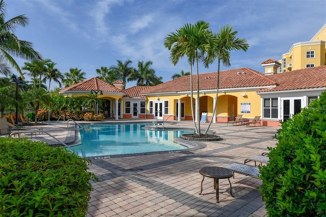 610 Riviera Dunes Way Unit 306, Palmetto, FL 34221 - community pool featuring french doors and a patio