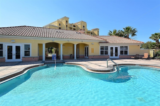 610 Riviera Dunes Way Unit 306, Palmetto, FL 34221 - view of swimming pool featuring french doors and a patio