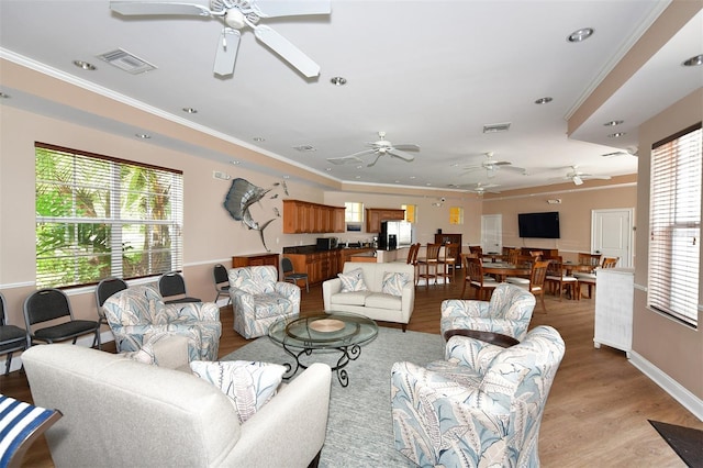 610 Riviera Dunes Way Unit 306, Palmetto, FL 34221 - living room featuring a ceiling fan, light wood-style floors, ornamental molding, and recessed lighting