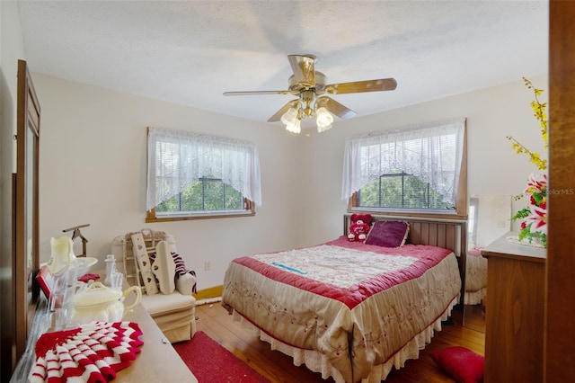 5034 257th St E, Myakka City, FL 34251 - bedroom with multiple windows, hardwood / wood-style flooring, and a ceiling fan