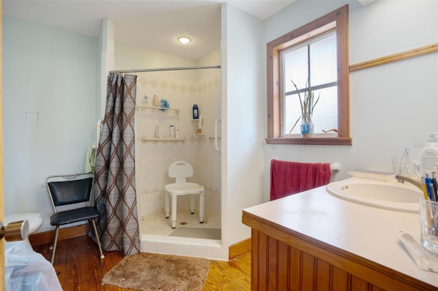 5034 257th St E, Myakka City, FL 34251 - full bath featuring wood finished floors, tiled shower, and vanity