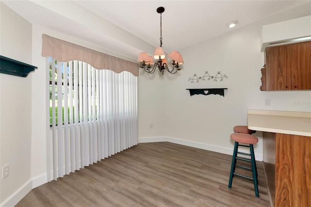 26147 L And J Rd, Myakka City, FL 34251 - unfurnished dining area with a chandelier and wood finished floors