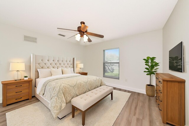 26147 L And J Rd, Myakka City, FL 34251 - bedroom with light wood-style flooring and a ceiling fan