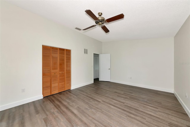 26147 L And J Rd, Myakka City, FL 34251 - unfurnished bedroom featuring wood finished floors, a closet, vaulted ceiling, and ceiling fan