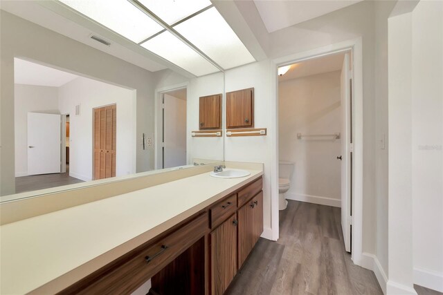 26147 L And J Rd, Myakka City, FL 34251 - bathroom featuring wood finished floors and vanity