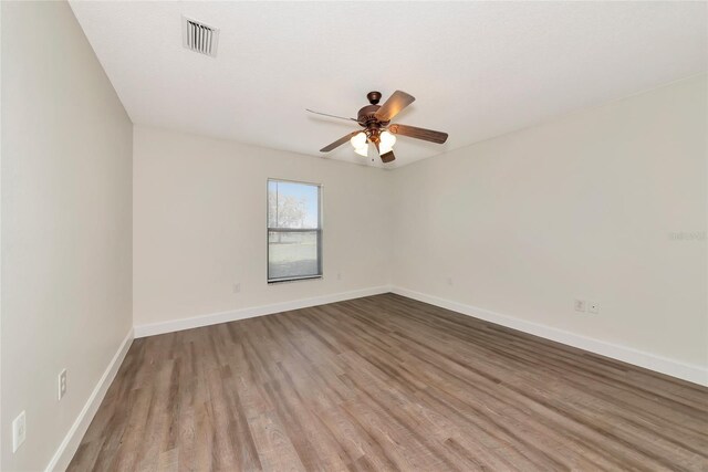 26147 L And J Rd, Myakka City, FL 34251 - unfurnished room with wood finished floors and a ceiling fan