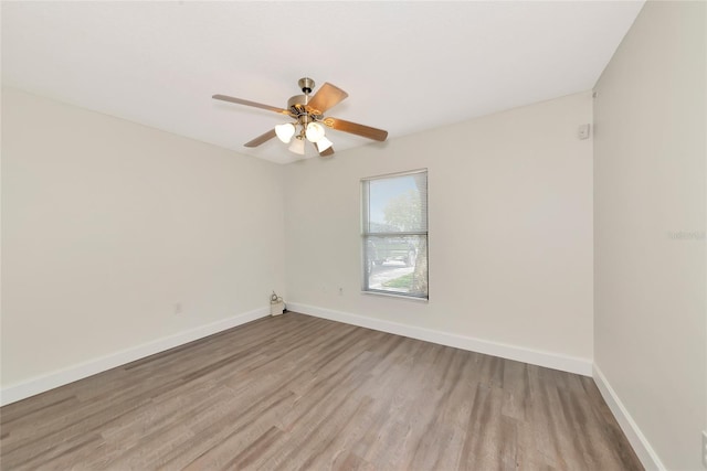 26147 L And J Rd, Myakka City, FL 34251 - empty room featuring wood finished floors and ceiling fan