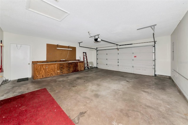 26147 L And J Rd, Myakka City, FL 34251 - garage featuring a garage door opener and electric panel