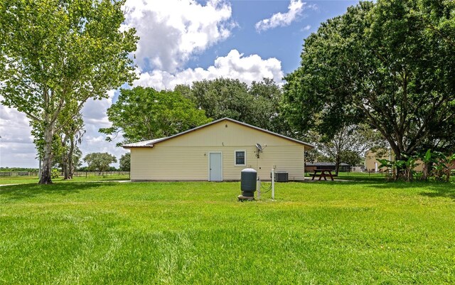 26147 L And J Rd, Myakka City, FL 34251 - view of home's exterior with a yard and a central AC unit
