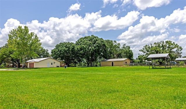26147 L And J Rd, Myakka City, FL 34251 - view of grassy yard with a garage and a gazebo