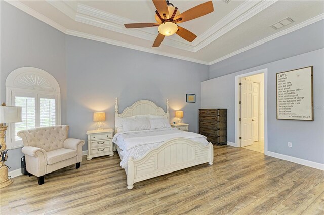 20207 71st Ave E, Bradenton, FL 34211 - bedroom featuring wood finished floors, a raised ceiling, ornamental molding, and a ceiling fan