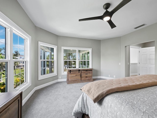 3959 Somerset Dr Unit 5, Sarasota, FL 34242 - carpeted bedroom featuring multiple windows and ceiling fan