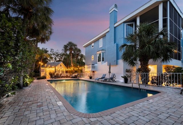 3959 Somerset Dr Unit 5, Sarasota, FL 34242 - pool at dusk with a patio area