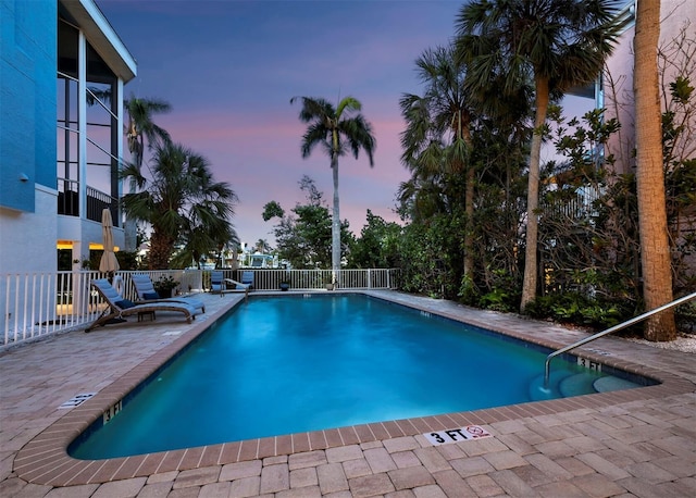 3959 Somerset Dr Unit 5, Sarasota, FL 34242 - pool at dusk with a patio and a community pool