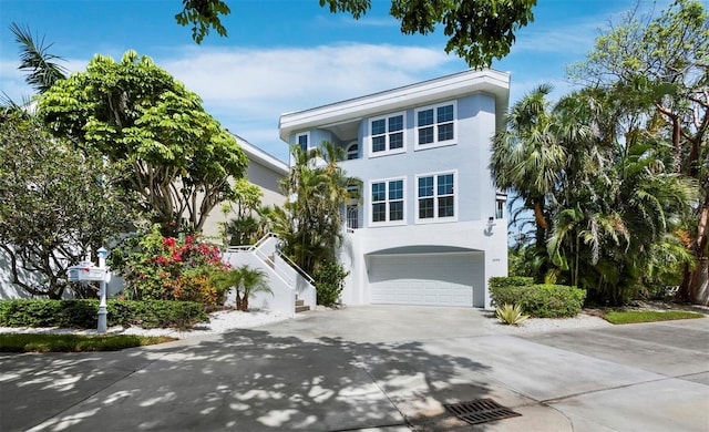 3959 Somerset Dr, Sarasota, FL 34242 - beach home with driveway, stairway, stucco siding, and a garage