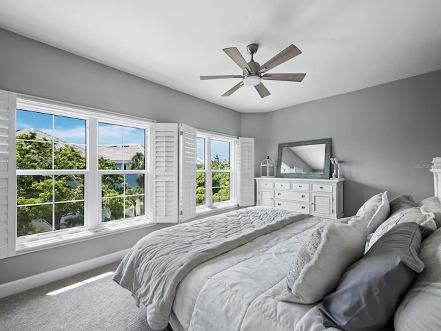 3959 Somerset Dr, Sarasota, FL 34242 - bedroom with carpet floors and ceiling fan